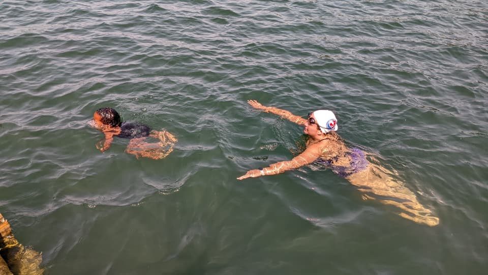 Coach Delia swims in Lake Kivu